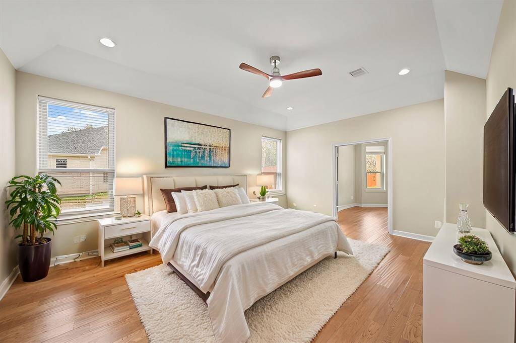 The bright and airy breakfast room offers a picturesque view of the covered patio, sparkling pool, and separate play area. A charming bay window fills the space with natural light, creating the perfect spot to start your day.