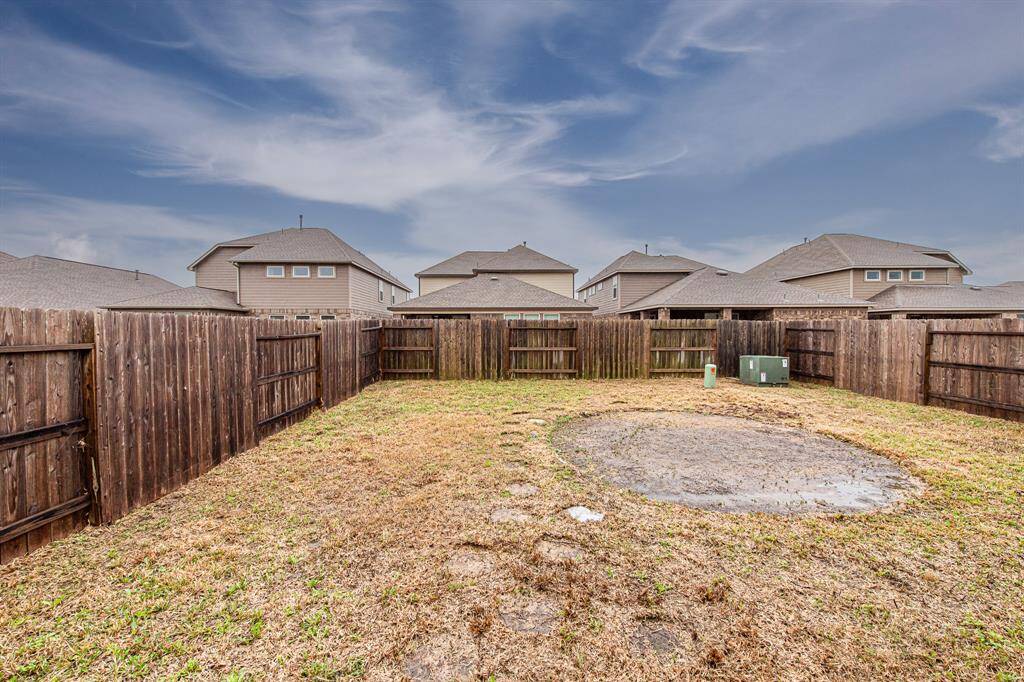 An above ground pool was recenlty removed therefore the patch of missing grass. This backyard offers plenty of space for your enjoyment.