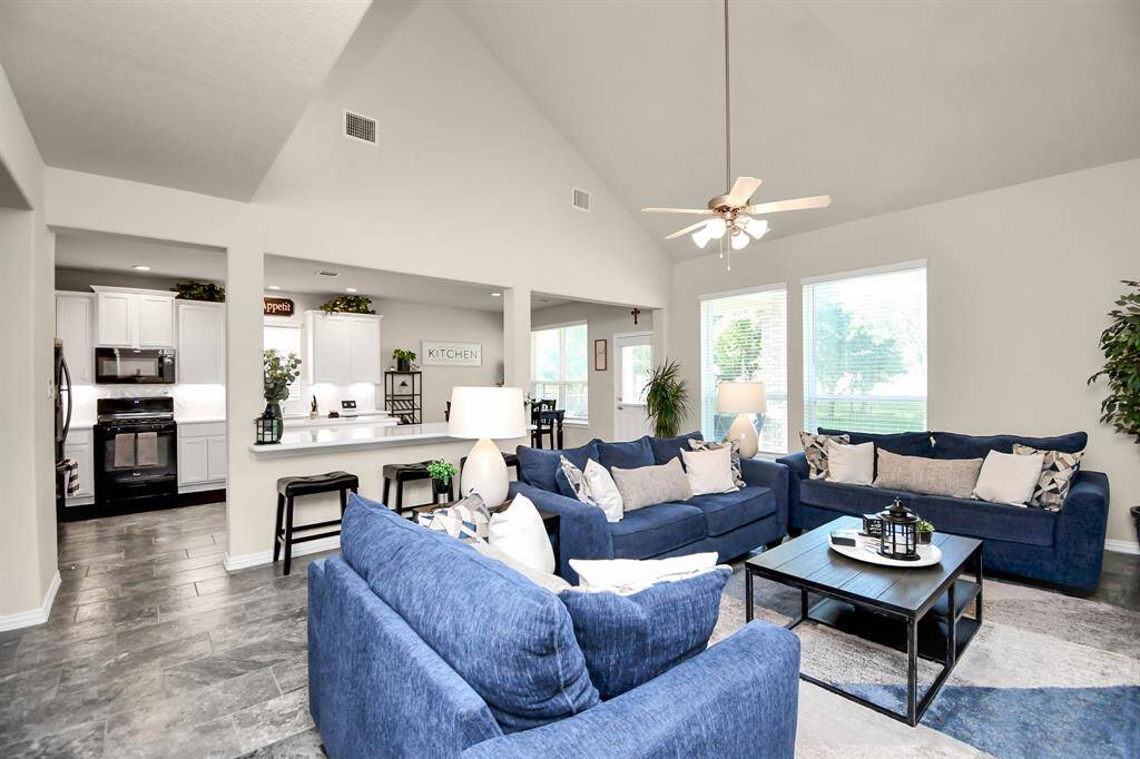 Continuing on with the open flow of the floor plan, just off the kitchen, you will find the family room. It has plenty of room whether you prefer a few large pieces of furniture or many smaller pieces. It's versatility gives you many options that suits your decorative style.