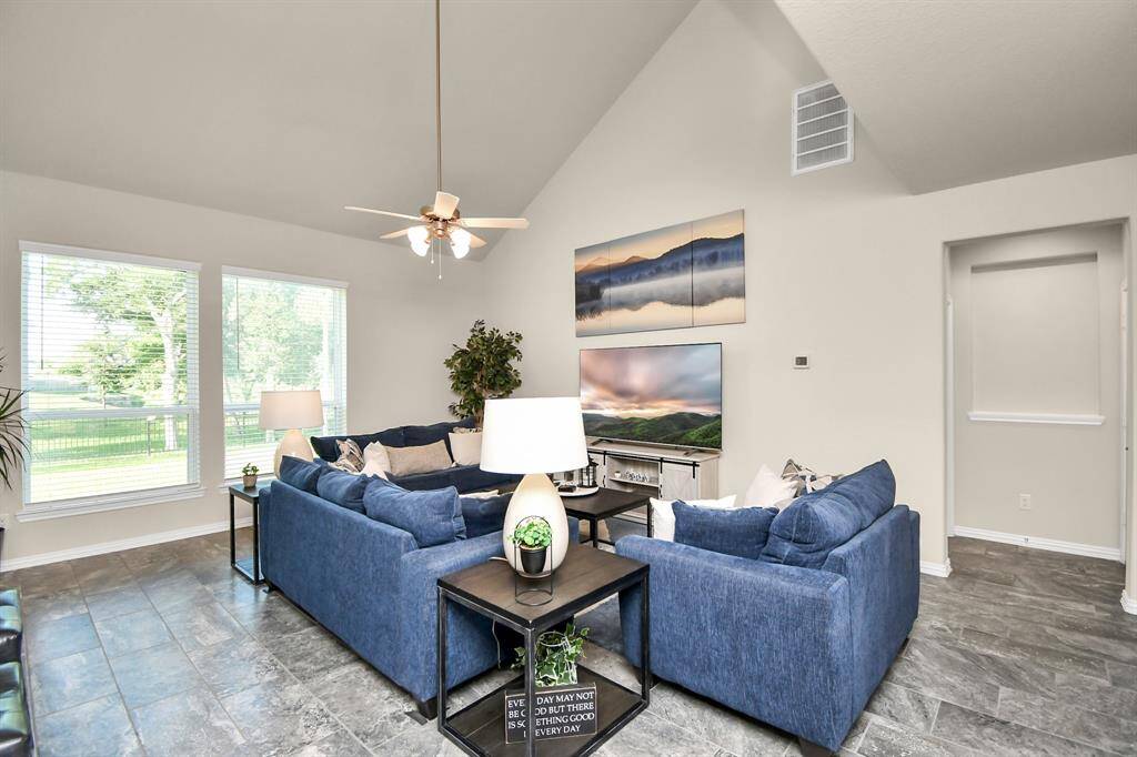 Continuing on with the open flow of the floor plan, just off the kitchen, you will find the family room. It has plenty of room whether you prefer a few large pieces of furniture or many smaller pieces. It's versatility gives you many options that suits your decorative style.