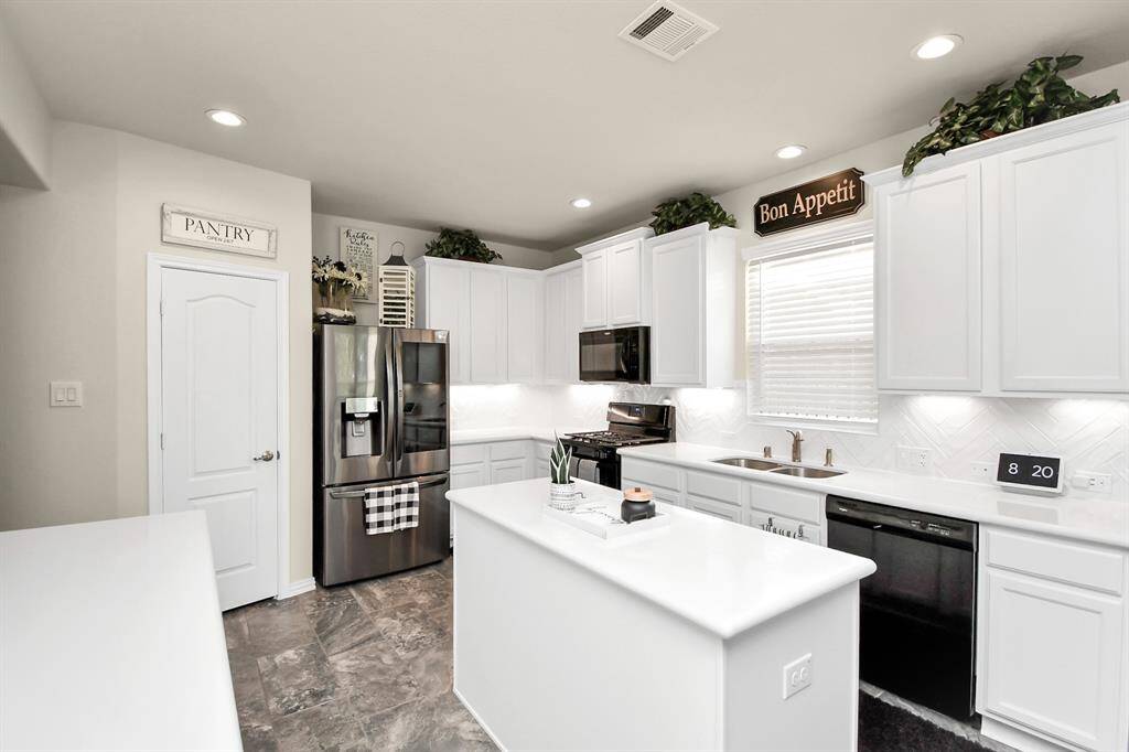 One of the impressive features of this home is it's modern kitchen with its quartz countertop and other upgrades that definitely will impress.