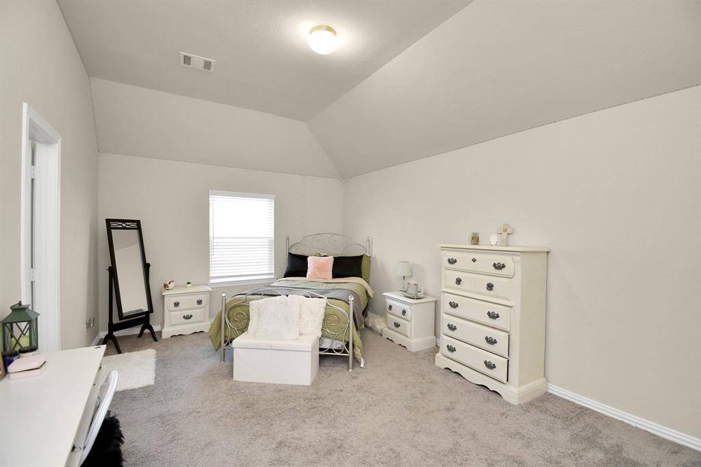 Another one of the secondary bedrooms. It is one of the two bedrooms connected to the Hollywood-style bathroom.
