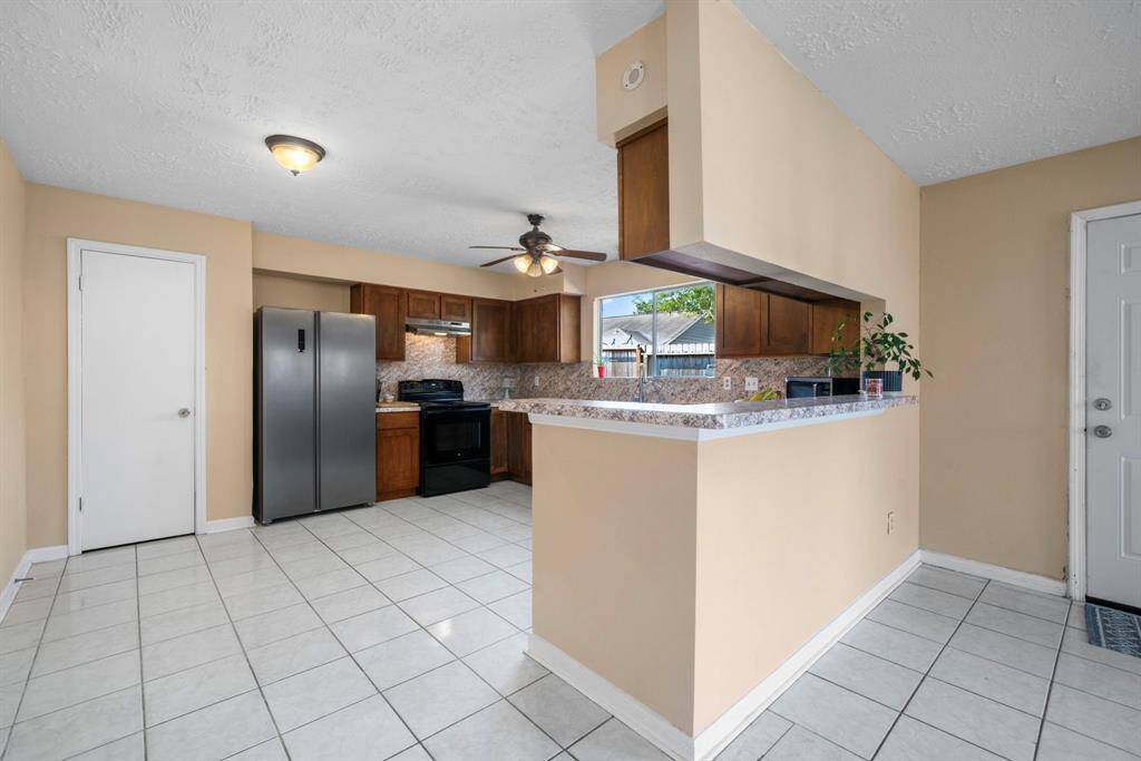 One of the largest kitchens you will ever see with maple cabinets and tons of counter space thi kitchen has space for an eat in breakfast table or an island...you decide.