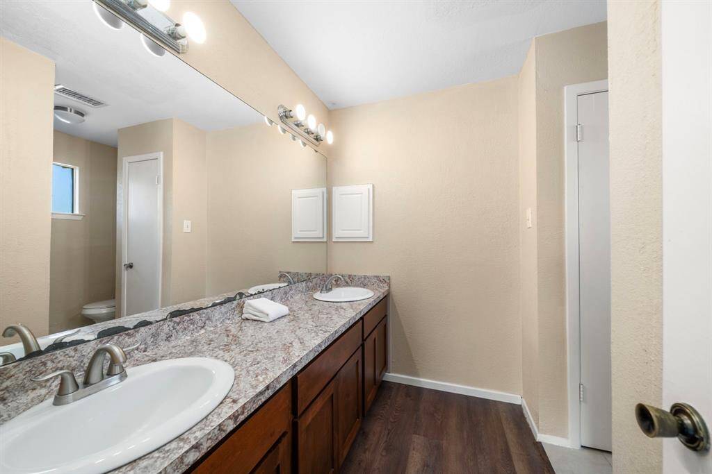 Primary bath is spacious and sophisticated.