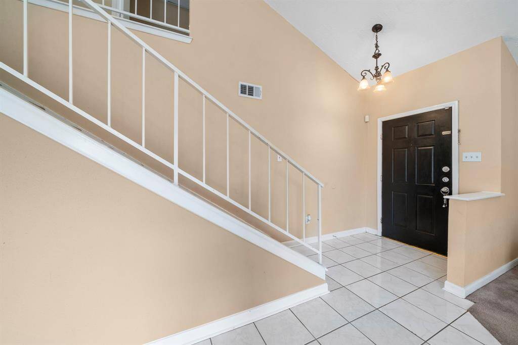 Stately entry into formal living room and formal dining room combination