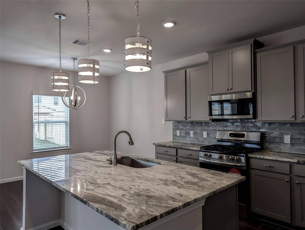 Pendant lights over the breakfast bar