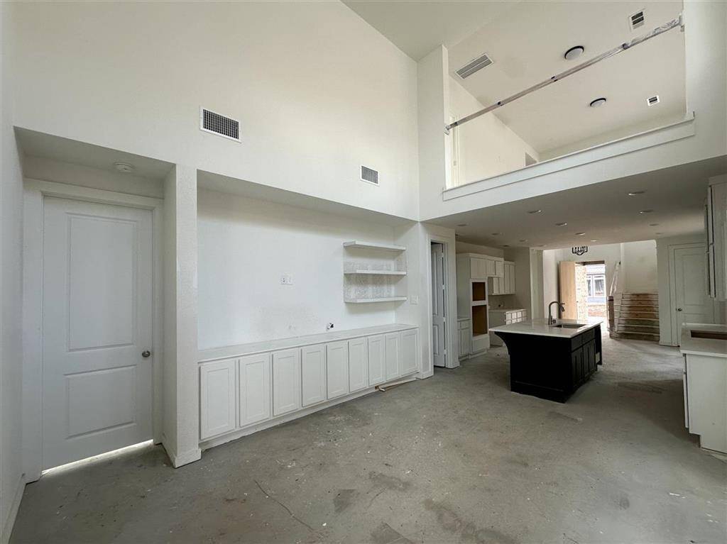 With high ceilings and an airy feel, this family room is all about spacious comfort