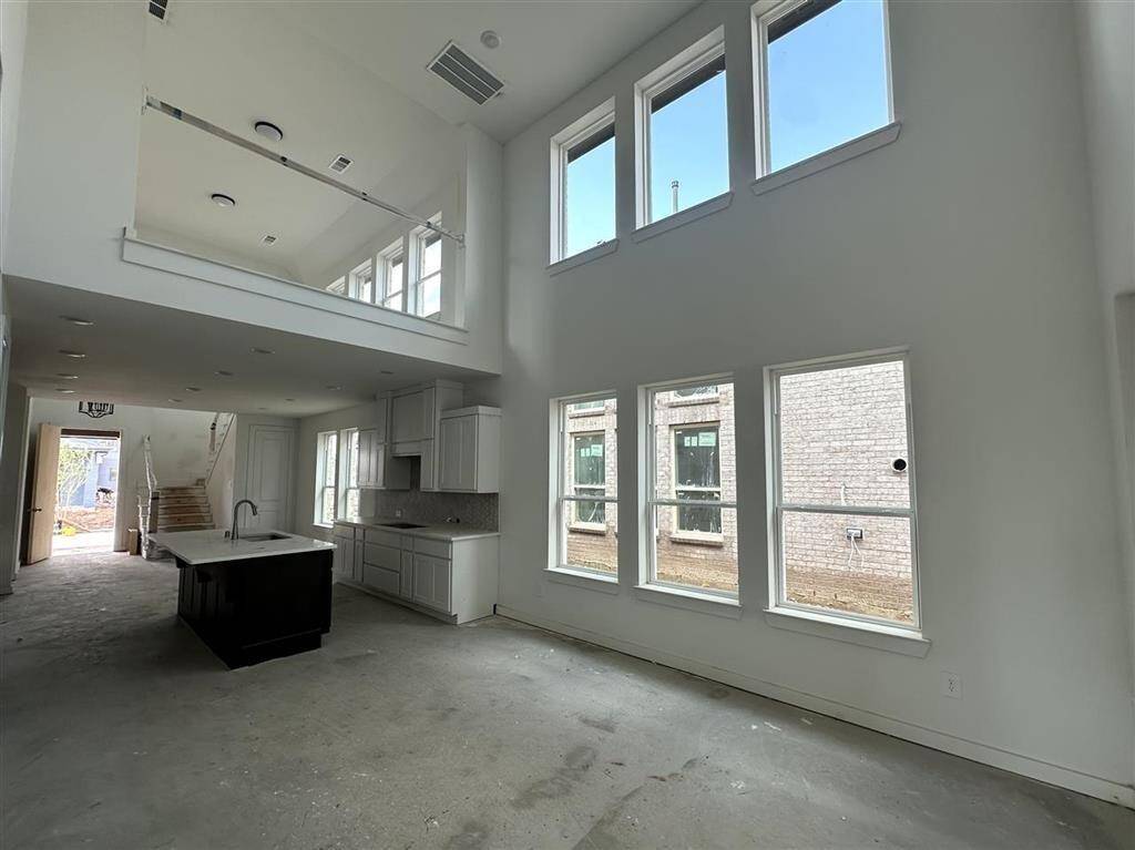 Sunlight pours in, filling this cozy family room with warmth and good vibes