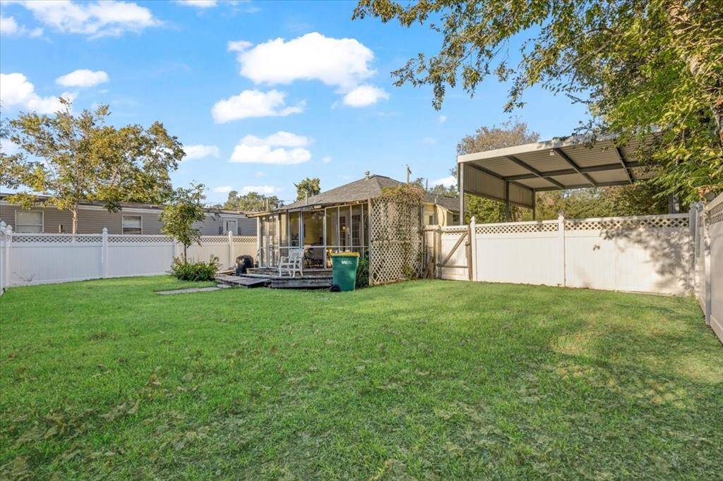 Backyard view of main house showing the RV parking cover