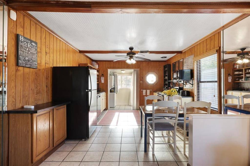 Dining area and kitchen in main residence with fully equipped kitchen