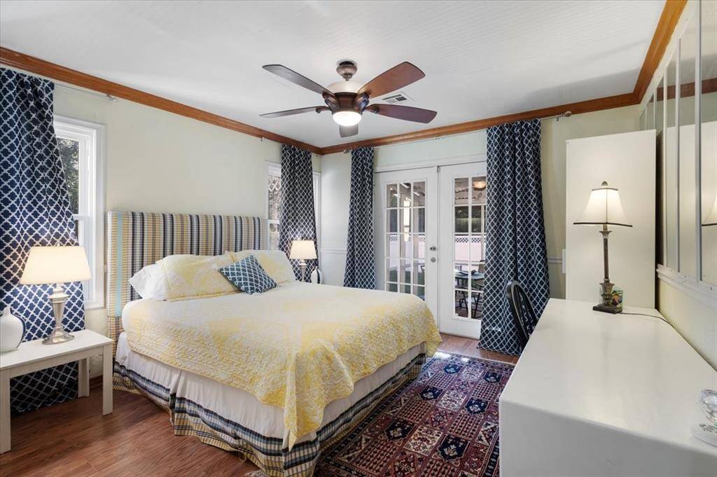 Primary bedroom in main residence that leads to the enclosed back patio