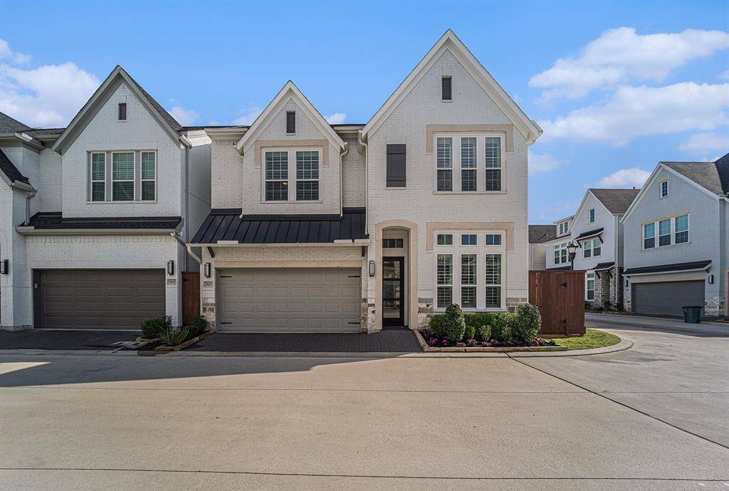 Charming brick exterior with an upgraded roof above the garage. Well-maintained landscaping and inviting entry add to the home's curb appeal. A perfect blend of classic style and modern updates.