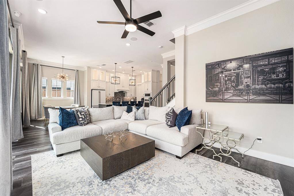 Spacious open floor plan seamlessly connects the living, dining, and kitchen areas, perfect for entertaining and modern living.
