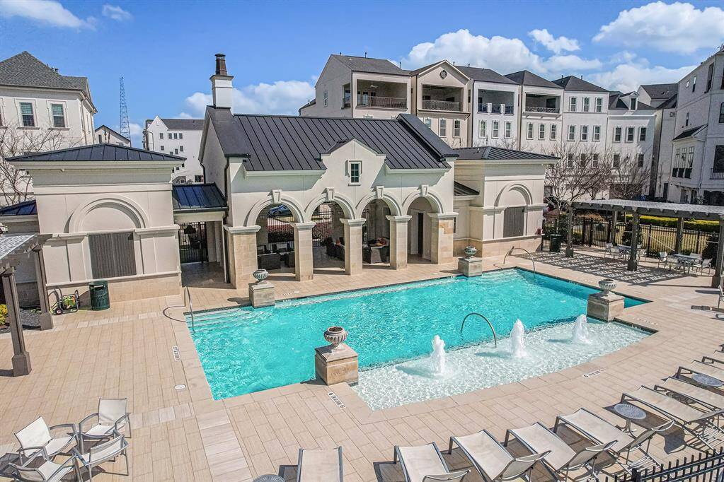 Relax and unwind at the pool, a perfect spot for leisure and socializing, offering a refreshing escape just steps from your home.
