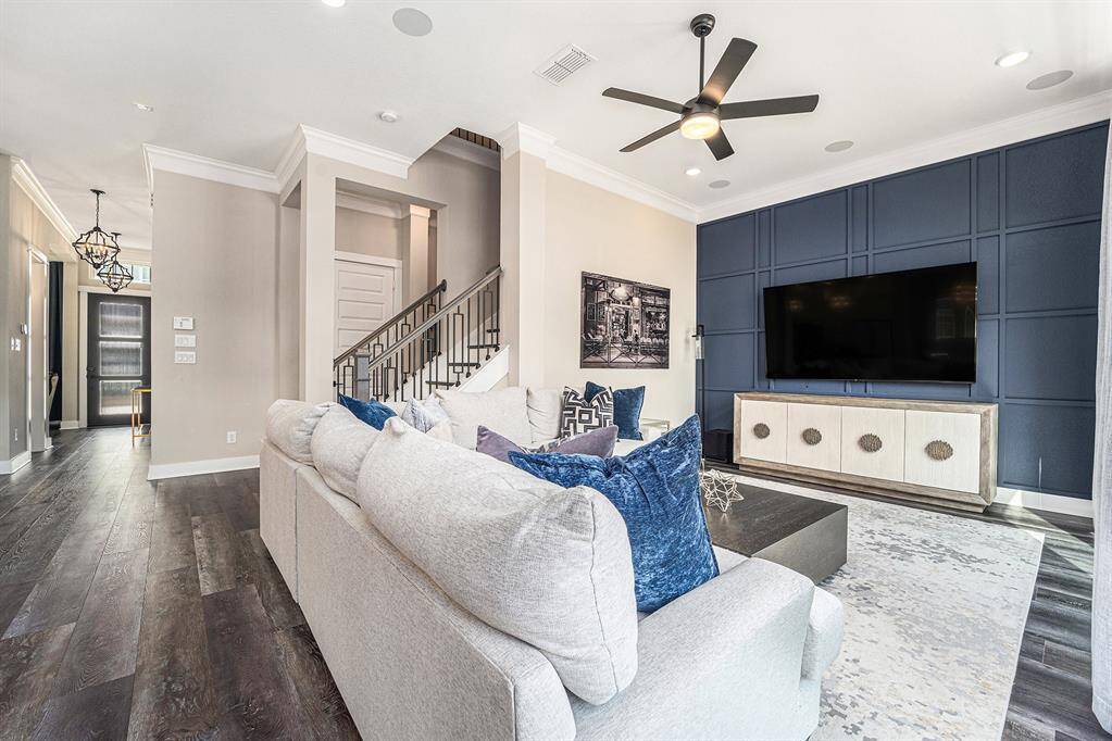 Designed for comfort and style, the sleek accent wall adds a contemporary touch, while natural light pours in, creating an inviting and airy ambiance. With a wired speaker system throughout the living room and kitchen, enjoy a premium sound experience that complements every moment.