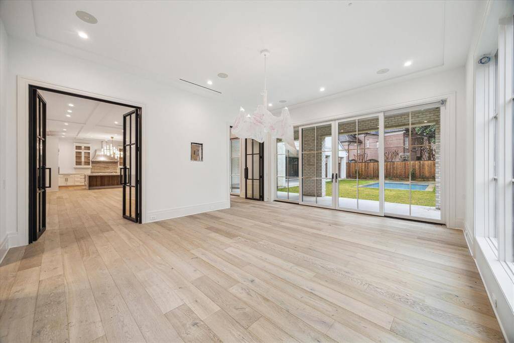 Family room looking towards great room and kitchen with great views of the pool and backyard