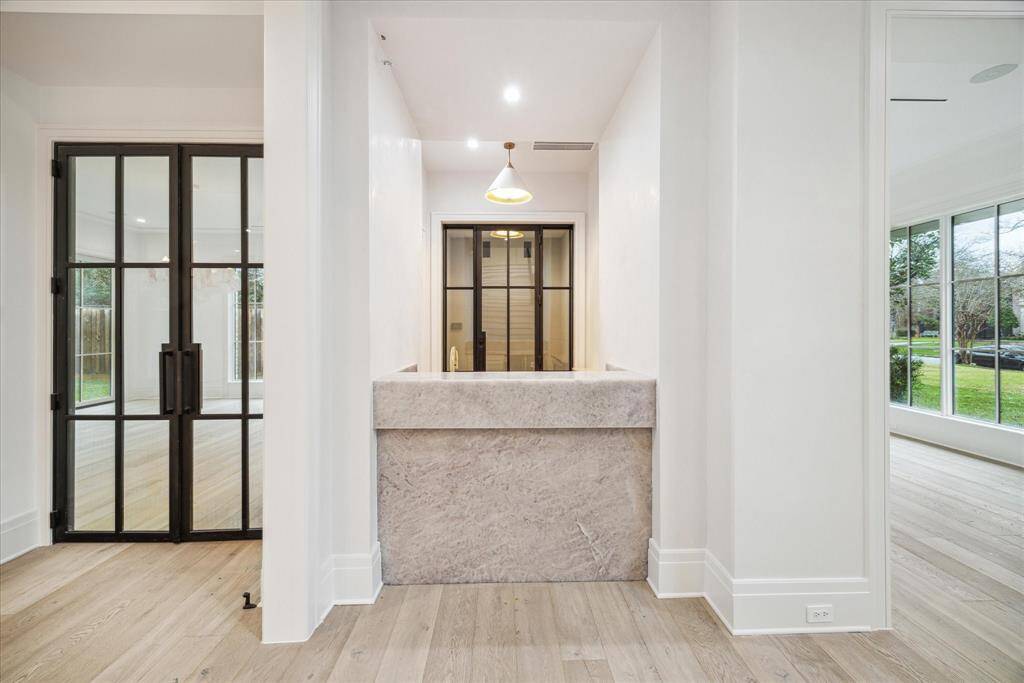 Bar with walk in temperature controlled wine room.