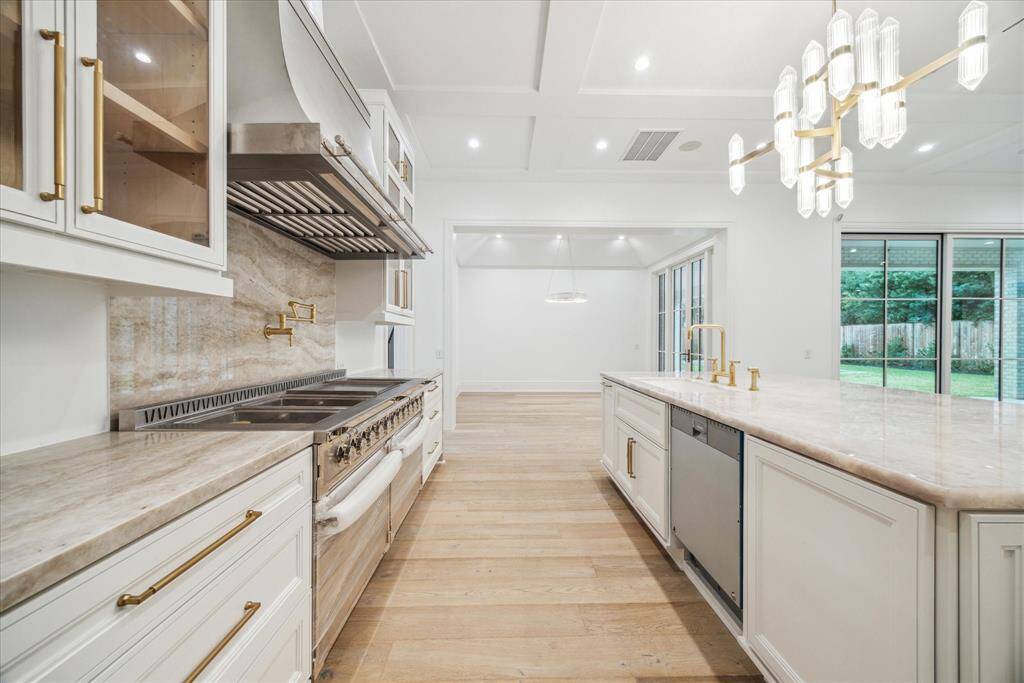 Island kitchen with L'Atelier Paris appliances. Looking towards breakfast room