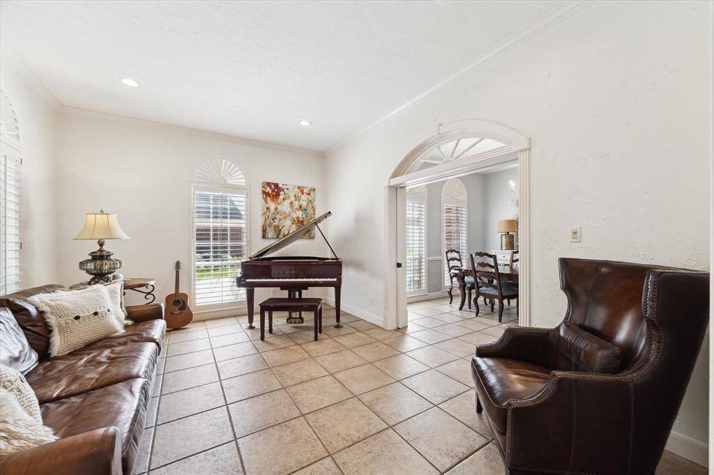 Pocket doors separating separating the living room and dining room.