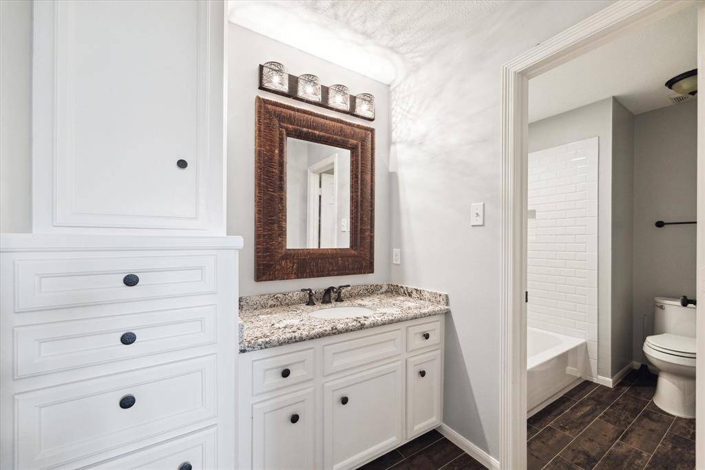 Jack and Jill bath with built-in drawers.