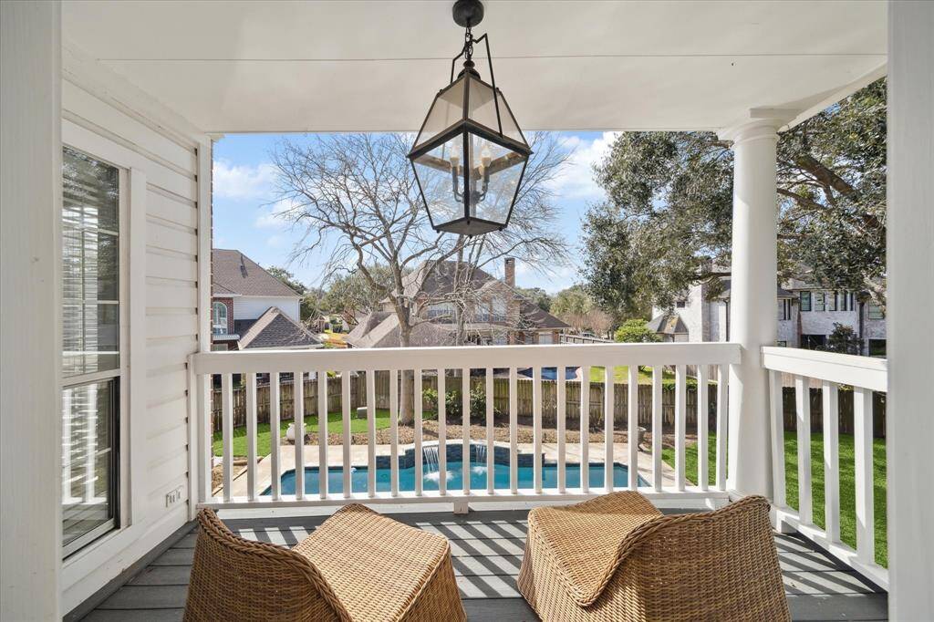 Upstairs balcony overlooks the pool.
