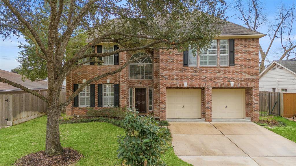 Surrounded by mature trees and lush foliage, the large windows fill the home with natural light, creating a warm and welcoming atmosphere. An ideal retreat for families seeking comfort and tranquility in a desirable suburban setting.