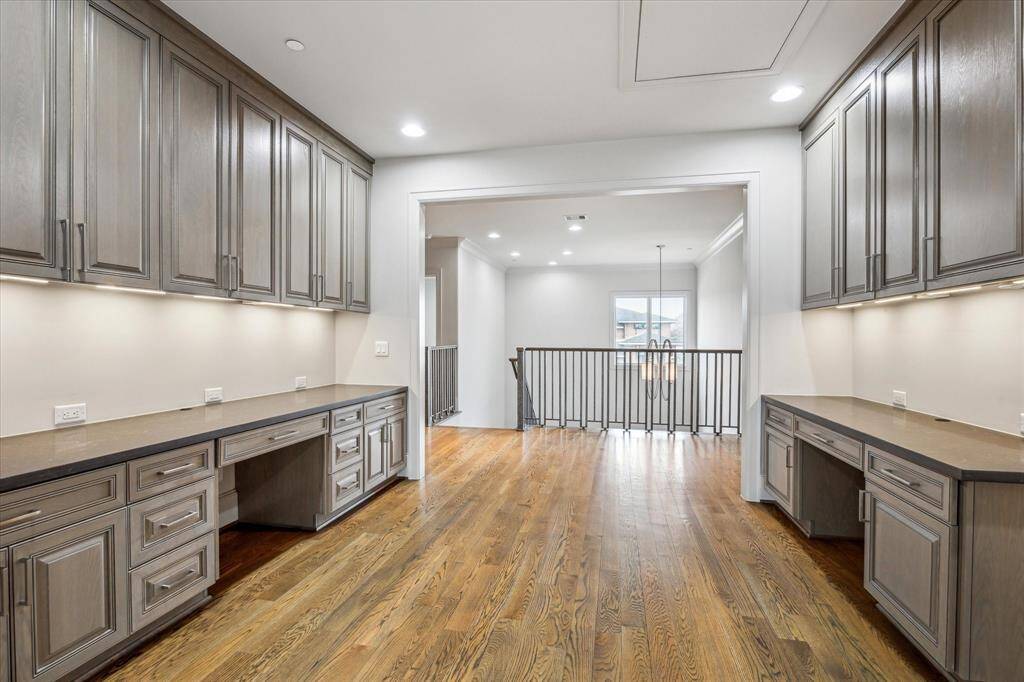 The second-floor landing offers a thoughtfully designed homework station, providing a quiet and functional space for work or learning. With built-in features and an open yet private layout, this versatile area is perfect for productivity while staying connected to the home’s flow.