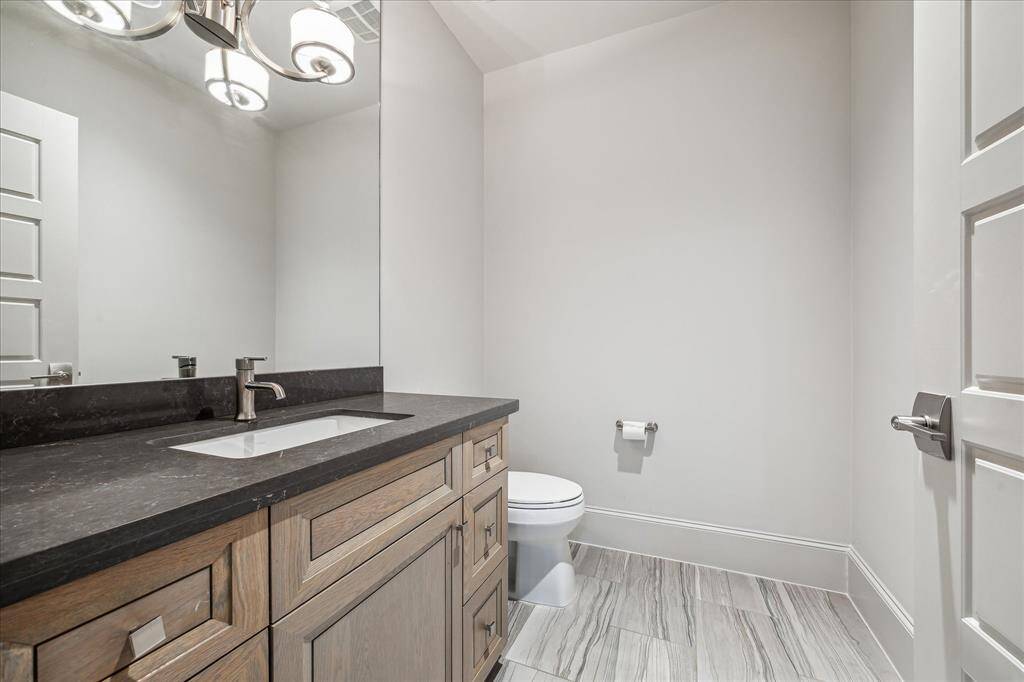 Powder Room on the 2nd floor: Conveniently located for guests, this stylish second-floor powder bath offers easy access from the game room, media room, and gym.