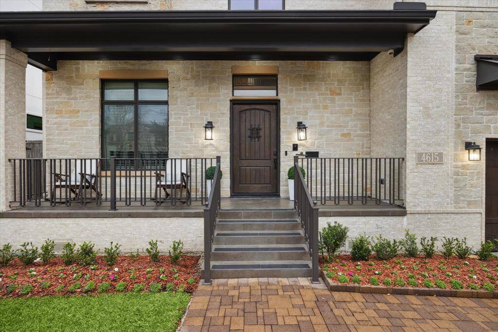 A stately staircase leads to a welcoming veranda, setting the stage for timeless curb appeal. The inviting porch and balcony enhance the home's architectural beauty, offering the perfect spots to relax and enjoy the surroundings.