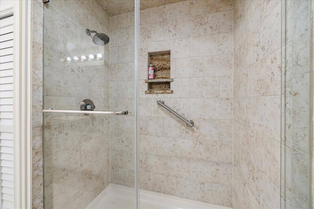 MASTER SHOWER:  Recessed shampoo box + grab bar.
