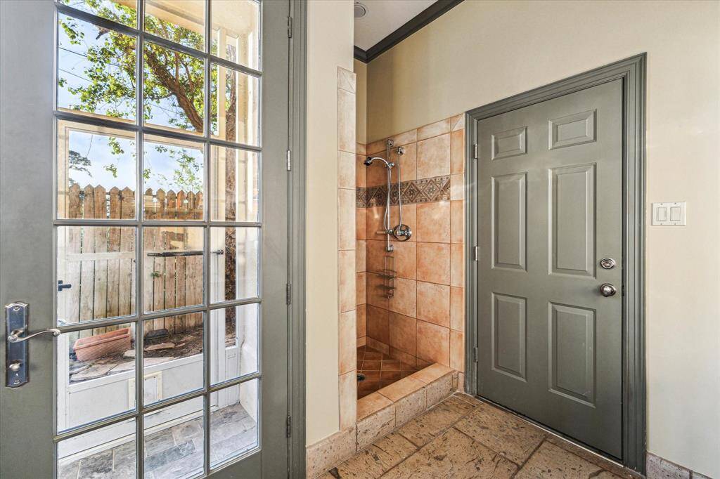 Home office/game room also accesses the garage and has a bonus shower area.