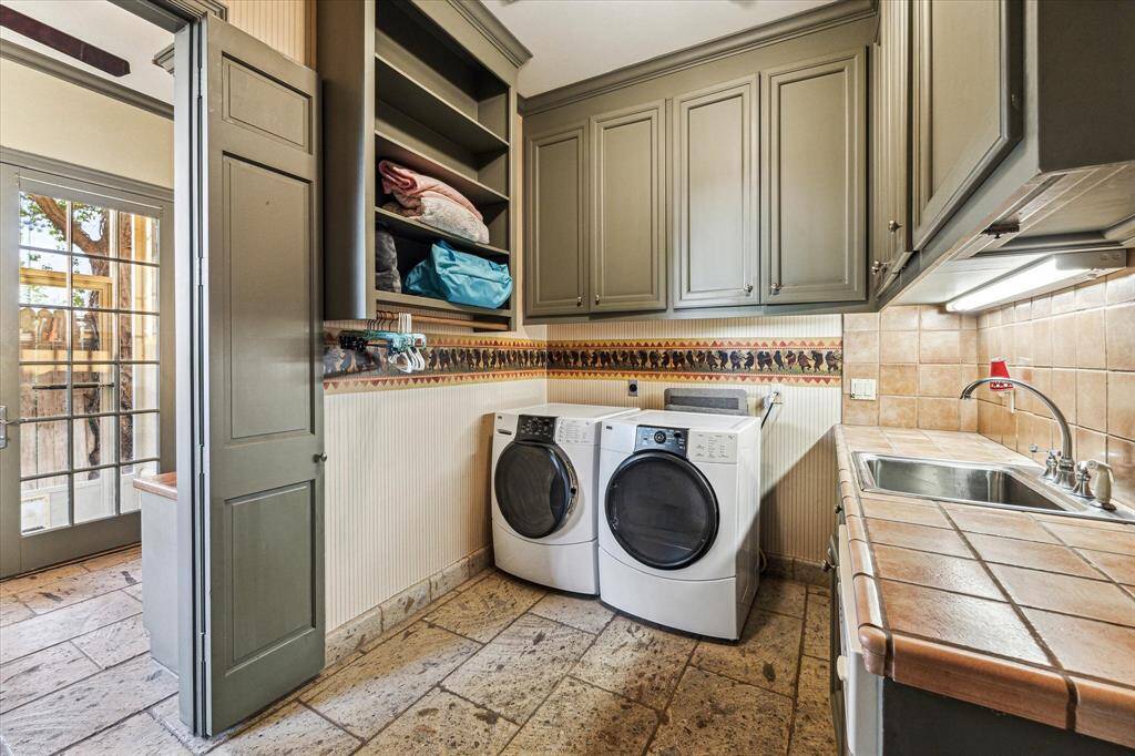 Utility room has lots of storage.