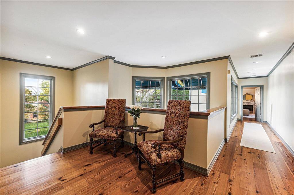 Second floor landing. Hallway leads to primary suite.