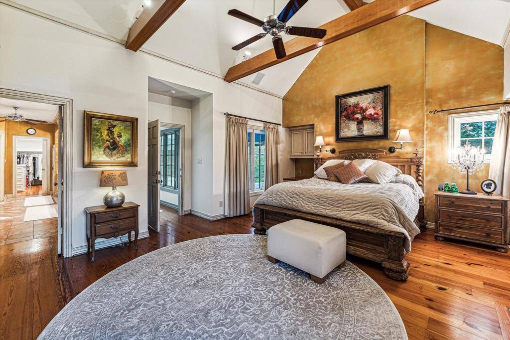 Primary bedroom features high ceilings, private balcony and incredible en suite bathroom with two walk in closets.