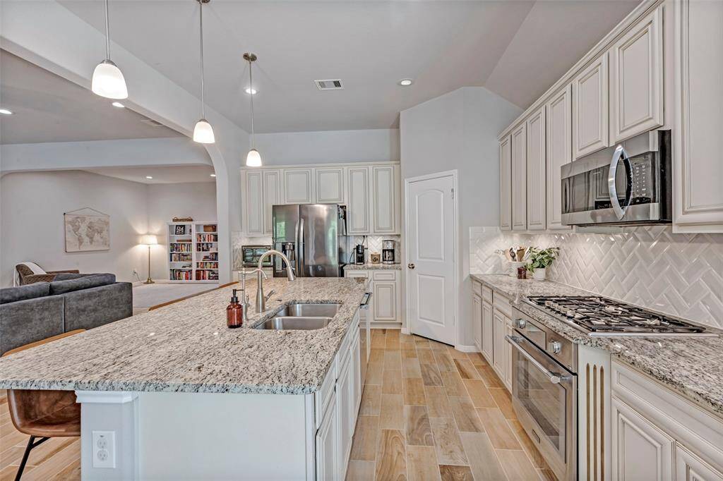 Open to the living, dining and breakfast area.