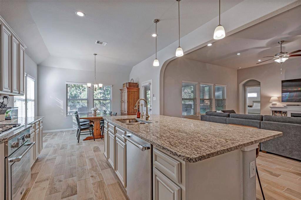 There is a walk in pantry and pendant lighting.