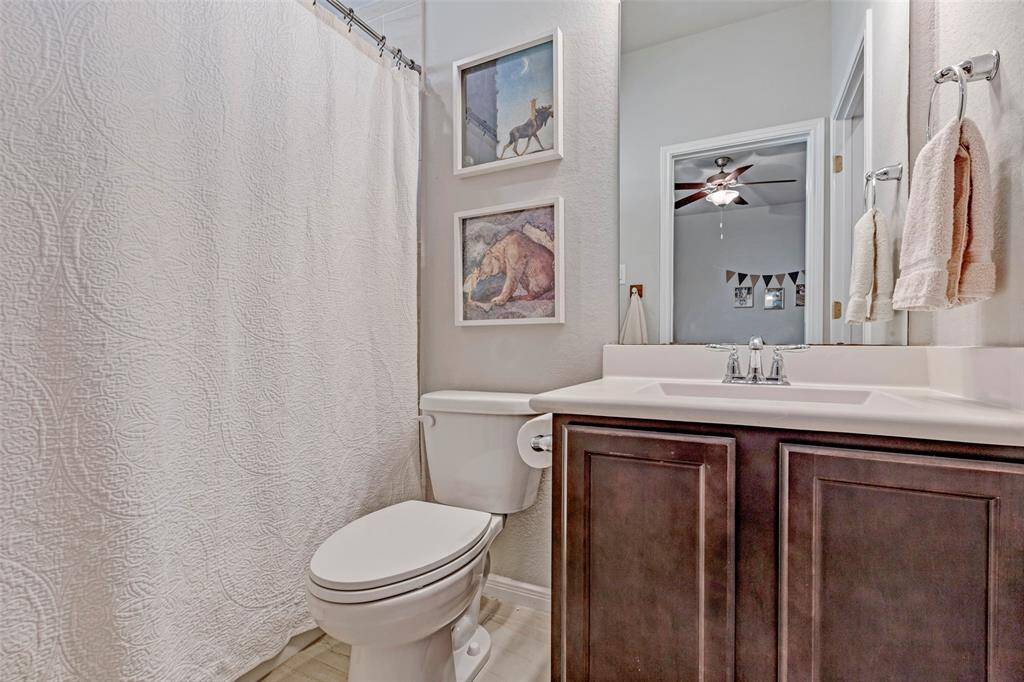 The full bath between these two bedrooms. The arch above the shower adds so much personality to the room.