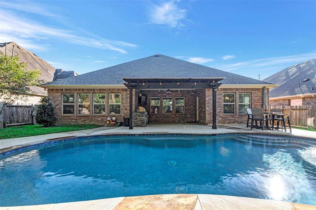 What a beautiful home overlooking the pool and covered patio.