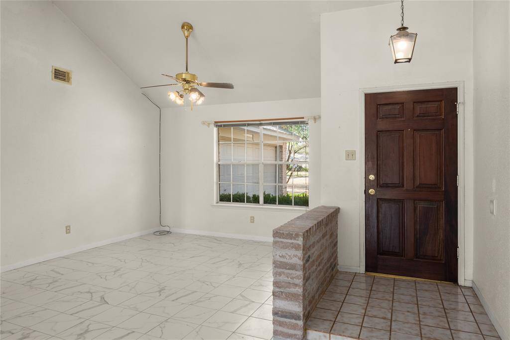 Natural light streams through this very large dining room window, illuminating the dining area, your large dining room table, chairs and buffet.  What a great place to host a late evening get-together!