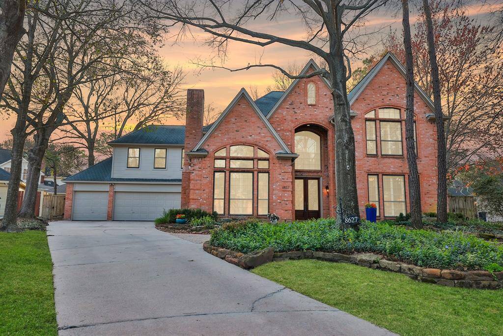 This elegant two-story home features a brick façade and large windows, offering a traditional, inviting look. The well-maintained front lawn and spacious driveway lead to a 3-car attached garage. The curb appeal is stunning!