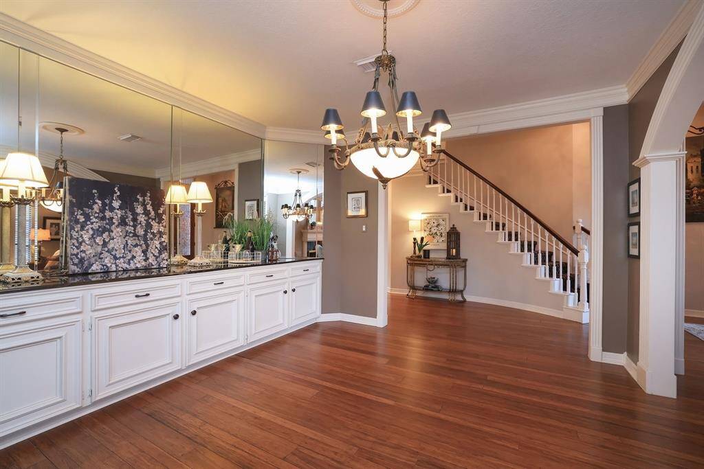 Another look at this wonderful dining space with tons of cabinets and drawers for your china and silverware!  The black granite countertop plays an important part of the entertaining experience and works as a wonderful service station!
