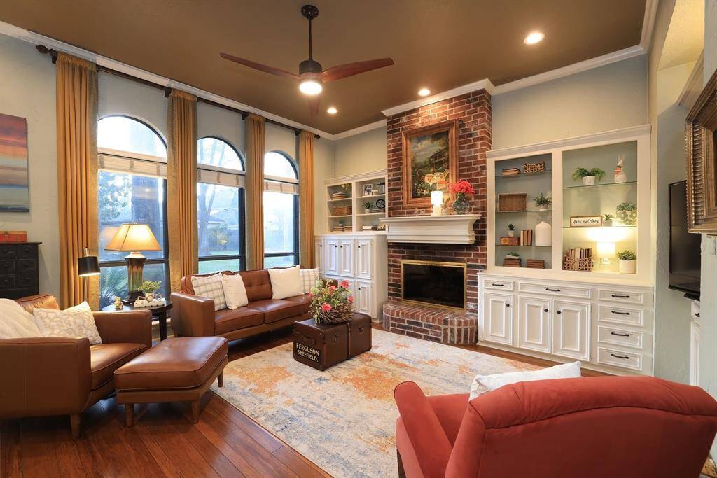 This tasteful, spacious room is a delight.  Light and dark tones combine to offer a warm, inviting atmosphere and is perfect for entertaining or relaxing with your favorite book or TV show!   The wood flooring is prominent throughout the 1st floor.