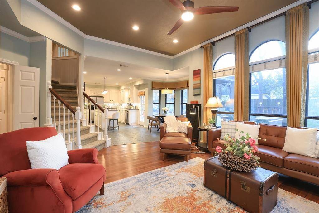 This impressive shot looks back from the Family Room to the kitchen.  To the left is the 2nd stairwell that leads to the Game Room!  This area lights up with natural lighting through floor to ceiling windows.