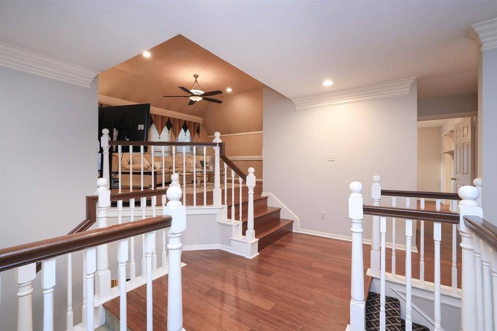 Directly at the top of the stairs, there is another stairwell to the left that leads down to the Family Room and Kitchen.  Straight ahead is the Game Room!