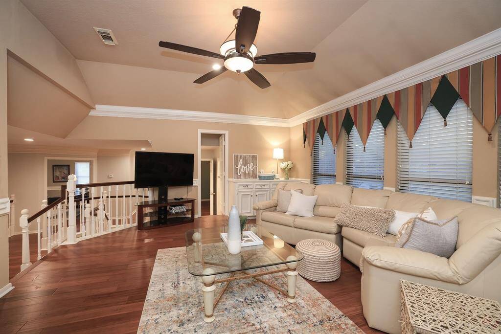 Friends and family can gather for Super Bowl fun in this nicely sized Game Room.  The built-in cabinets would be a great storage area or a place to serve your favorite hors d'oeuvres and drinks!  There is a full size bathroom just to the right of where the sellers TV was placed!
