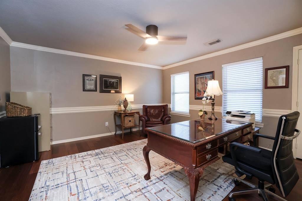 This flexible space can be utilized as an inviting home office or perfect guest room!  Wood flooring, crown molding and remote controlled ceiling fan are just some of the amenities!
