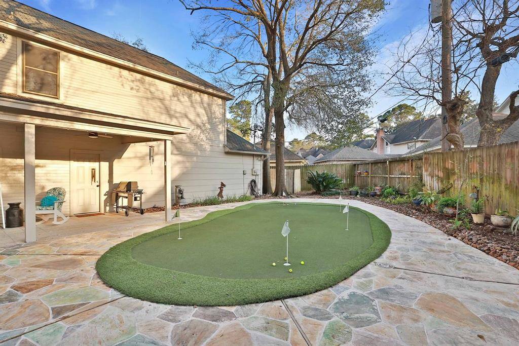 Another view of the green just off the expanded covered patio.  Flagstone decking covers this part of the back yard along with rock gardens to the right for simple landscaping.