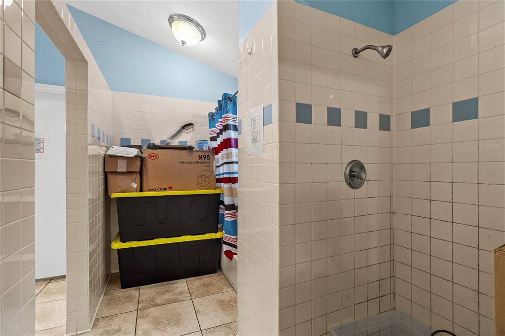 A closer look at the shower stalls in this spacious bathroom!