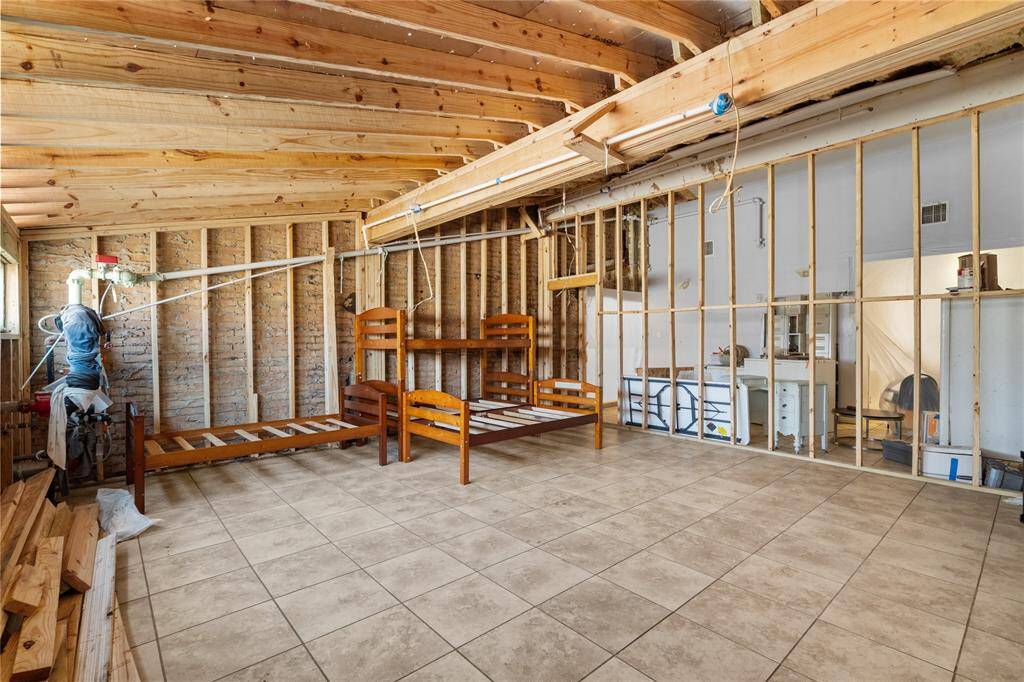 The unfinished nature of the room makes it a blank canvas, ready to be transformed into any desired space. The open layout and exposed framework provide flexibility for creating different configurations and layouts to suit specific needs. Whether it's a dormitory, a workshop, a studio, or any other purpose, the room's clean slate offers endless possibilities for customization and adaptation.