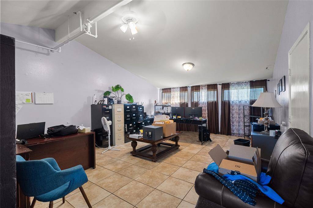 This spacious room with a ceiling that vaults could have multiple potential uses. There is plenty of natural light coming in through the windows, making it inviting!
